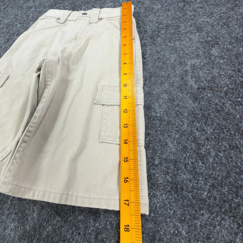Ruler alongside the outer leg of khaki Lee Pipes cargo shorts