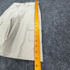 Ruler alongside the outer leg of khaki Lee Pipes cargo shorts