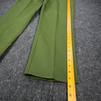 Ruler alongside the outer leg of green Aldens pants